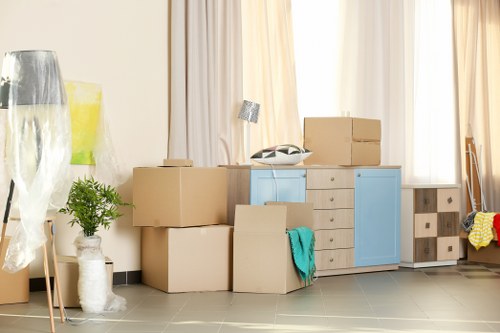 Packed boxes and household items ready for a moving van in Hainault