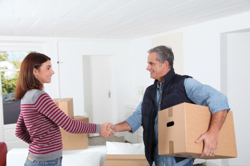 A local packing team preparing items for a move in Hainault