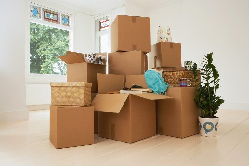 Professional movers handling household items during a Hainault relocation
