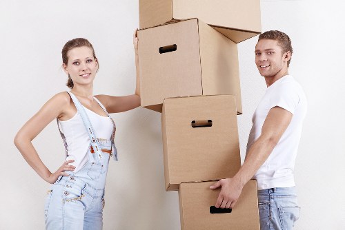 Preparing boxes and furniture for a man with van removal in Hainault