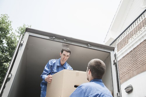 Packed moving boxes and furniture ready for removal in Hainault