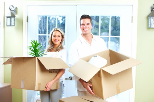 Packed boxes and furniture ready for local removal in Hainault