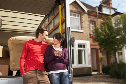 Professional movers handling furniture during a Hainault relocation