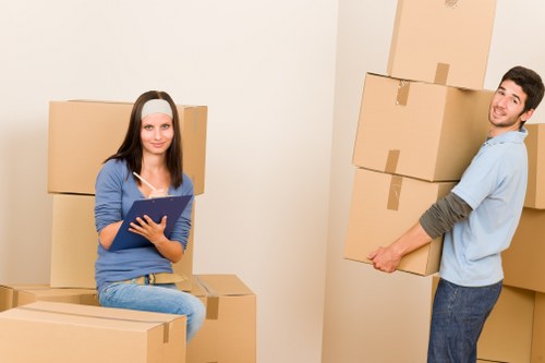 Removal team handling furniture and boxes during a house move