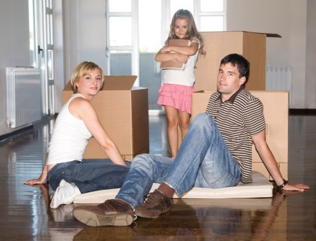 Packed boxes and furniture ready for loading into a removal van